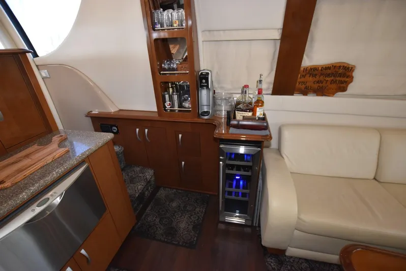 Seawood Yacht Photos Pics Interior of 2007 Carver 52 Voyager yacht with bar area and white sofa.