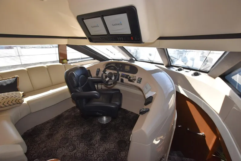 Seawood Yacht Photos Pics Luxurious 2007 Carver 52 Voyager yacht interior with helm and seating area.