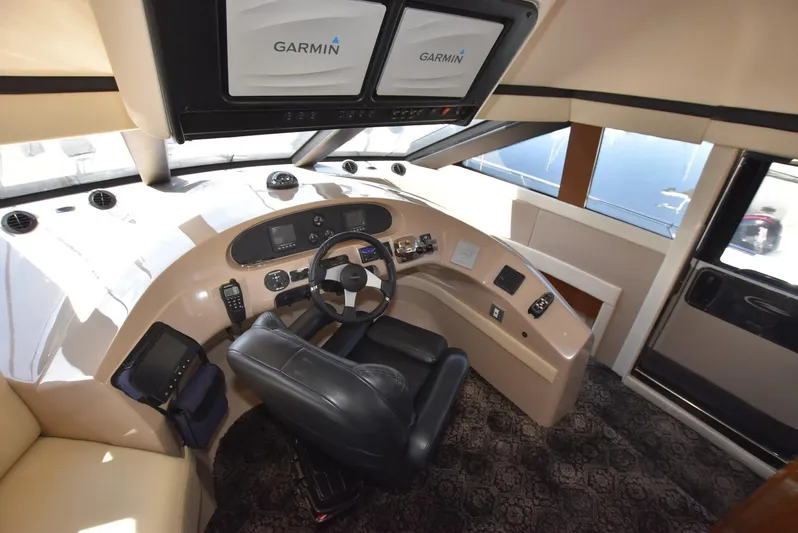 Seawood Yacht Photos Pics Interior helm of 2007 Carver 52 Voyager yacht with Garmin navigation system.