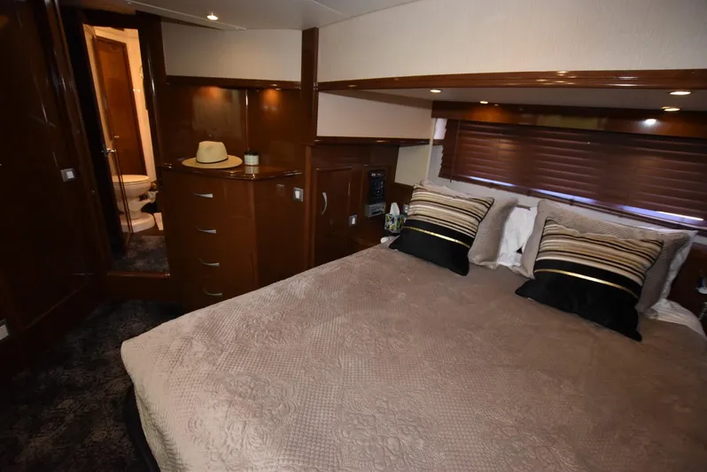 Seawood Yacht Photos Pics Luxurious bedroom interior of 2007 Carver 52 Voyager yacht with elegant wood finishes.