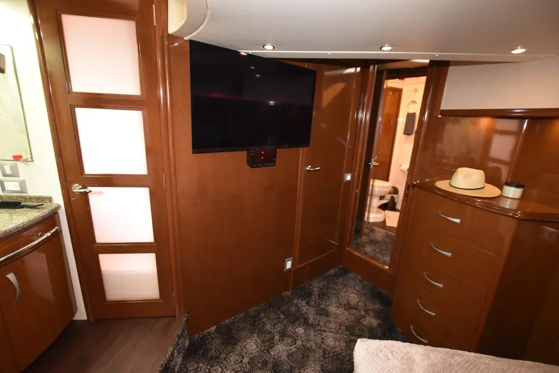 Seawood Yacht Photos Pics Luxurious interior of 2007 Carver 52 Voyager yacht with TV and elegant wood finishes.