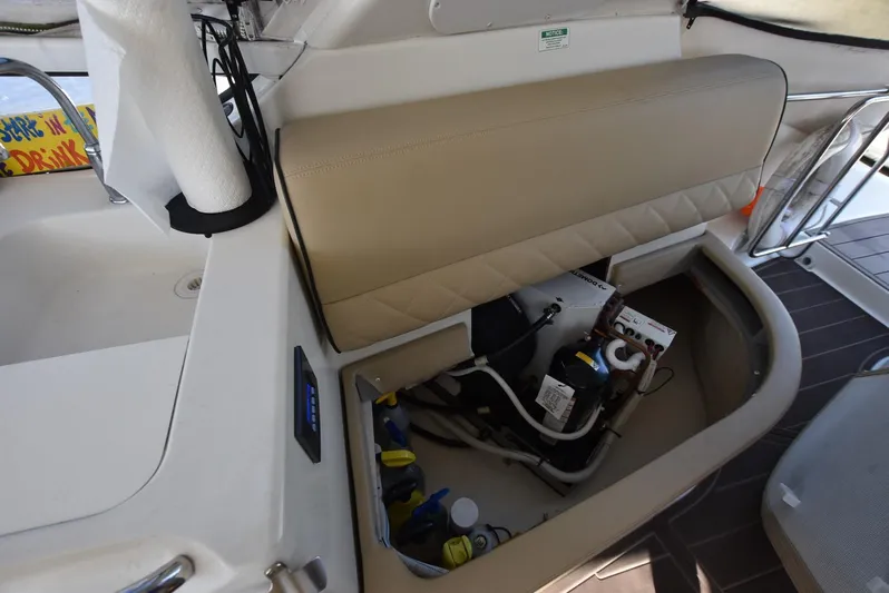 Seawood Yacht Photos Pics 2007 Carver 52 Voyager boat interior storage compartment with equipment and supplies.