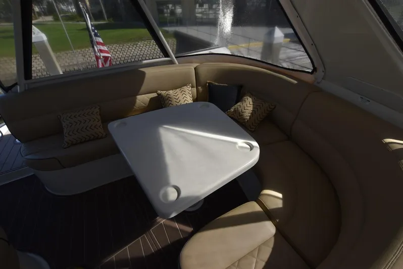 Seawood Yacht Photos Pics Interior of 2007 Carver 52 Voyager yacht with cushioned seating and table.