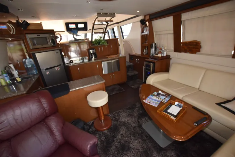 Seawood Yacht Photos Pics Luxurious interior of 2007 Carver 52 Voyager yacht with modern kitchen and comfortable seating.