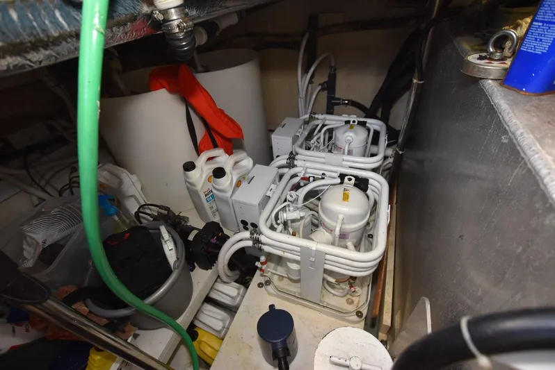 Seawood Yacht Photos Pics Engine room of 2007 Carver 52 Voyager with mechanical components and wiring.