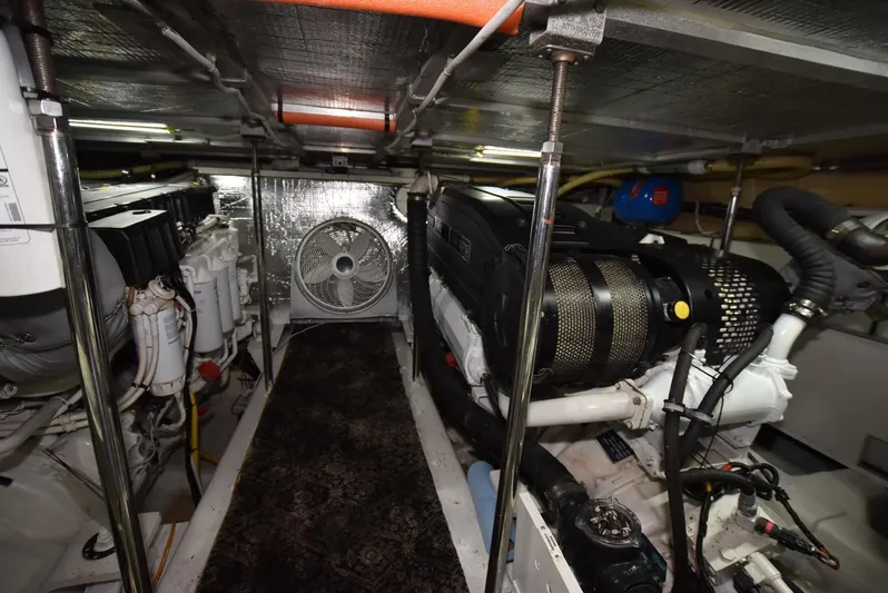 Seawood Yacht Photos Pics Engine room of 2007 Carver 52 Voyager yacht, featuring mechanical components and ventilation system.