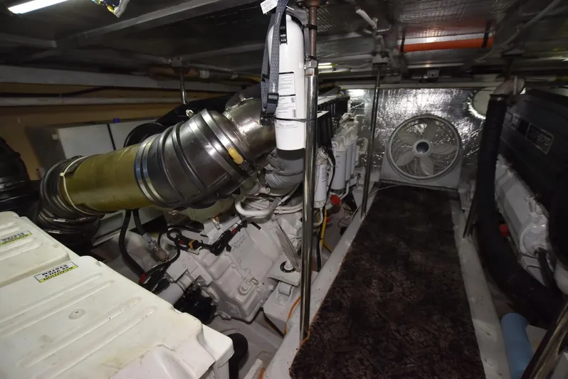 Seawood Yacht Photos Pics Engine room of 2007 Carver 52 Voyager yacht, featuring mechanical components and ventilation system.