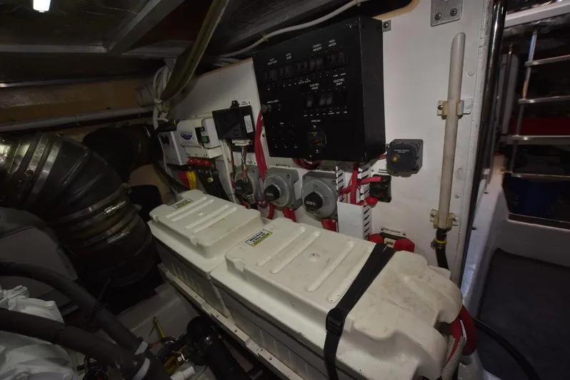 Seawood Yacht Photos Pics Engine room of 2007 Carver 52 Voyager with control panels and machinery.