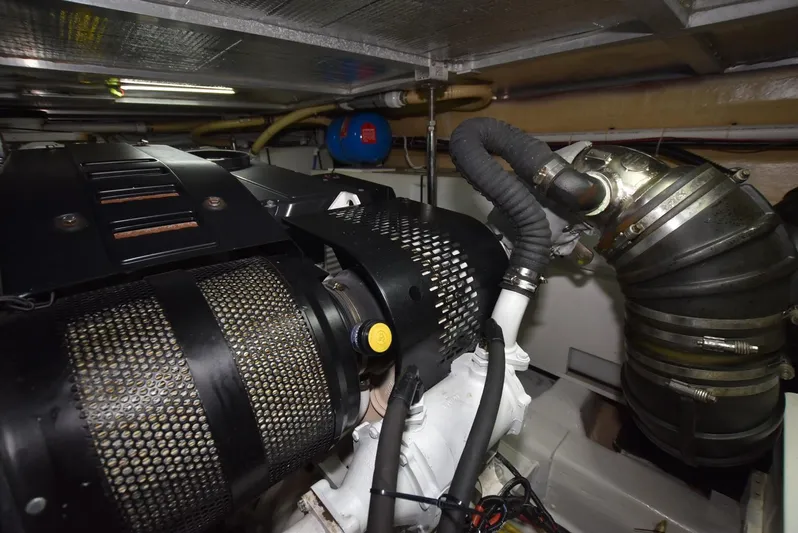 Seawood Yacht Photos Pics Engine room of 2007 Carver 52 Voyager yacht, showcasing mechanical components and ventilation system.