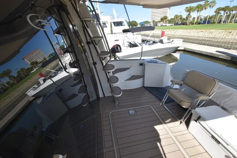 Seawood Yacht Photos Pics 2007 Carver 52 Voyager yacht deck with seating and dock view.