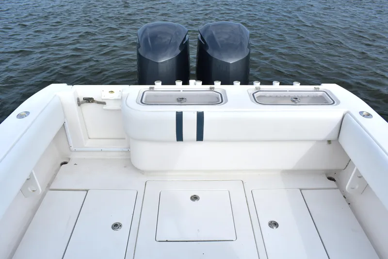  Yacht Photos Pics 2007 Contender 33 Tournament boat deck with dual engines on water.