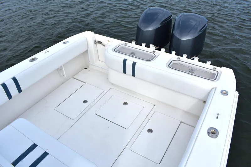  Yacht Photos Pics 2007 Contender 33 Tournament boat deck with dual outboard motors on water.