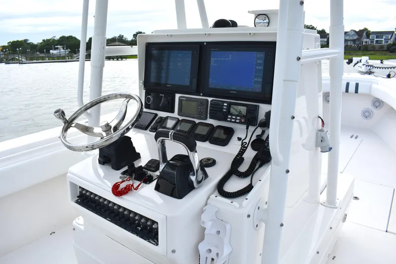  Yacht Photos Pics Center console of a 2007 Contender 33 Tournament boat with navigation equipment.