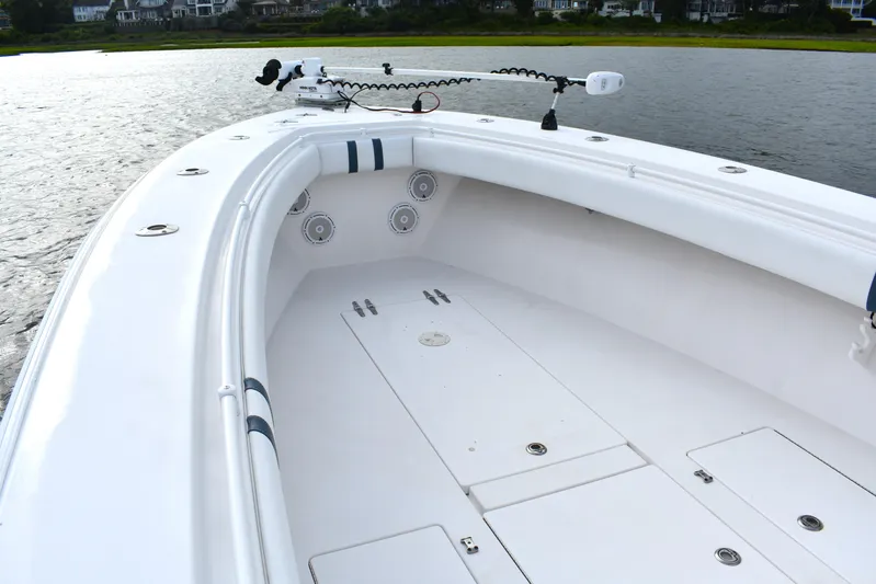  Yacht Photos Pics 2007 Contender 33 Tournament boat, spacious deck, sleek design, on calm water.