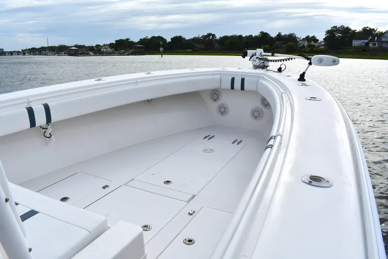  Yacht Photos Pics 2007 Contender 33 Tournament boat on calm water, showcasing spacious deck and sleek design.