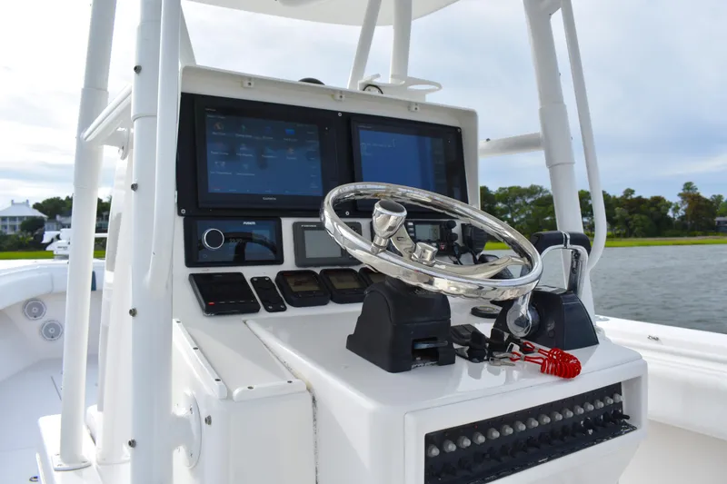  Yacht Photos Pics 2007 Contender 33 Tournament boat dashboard with steering wheel and dual navigation screens.