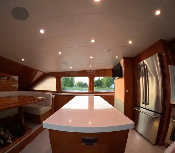 Sterling V Yacht Photos Pics Luxurious kitchen interior of 2007 Hargrave 93' yacht with modern appliances and seating area.