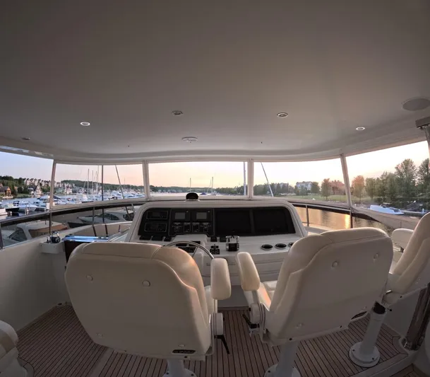 Sterling V Yacht Photos Pics Interior view of 2007 Hargrave 93' yacht helm with sunset marina backdrop.