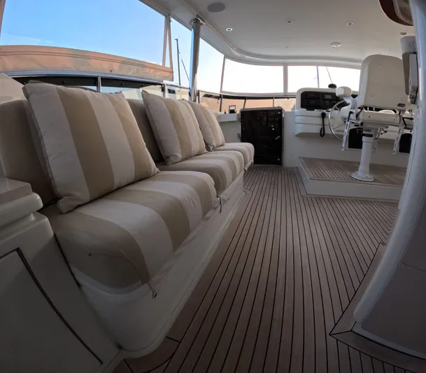 Sterling V Yacht Photos Pics Luxurious 2007 Hargrave yacht interior with striped seating and elegant wood flooring.