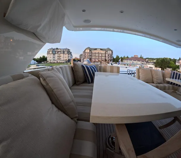 Sterling V Yacht Photos Pics Luxurious seating area on 2007 Hargrave 93' yacht with scenic waterfront view.