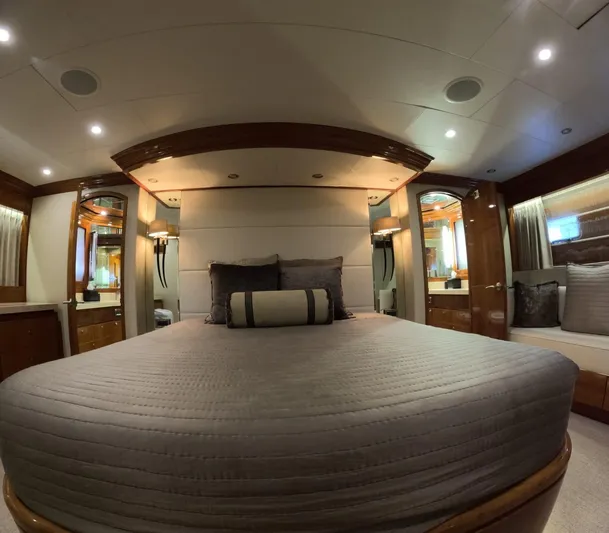 Sterling V Yacht Photos Pics Luxurious bedroom interior of 2007 Hargrave 93' yacht with elegant wood accents.