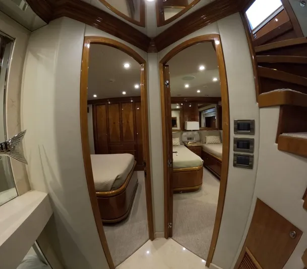 Sterling V Yacht Photos Pics Interior of 2007 Hargrave 93' yacht showing luxurious bedrooms and wooden finishes.
