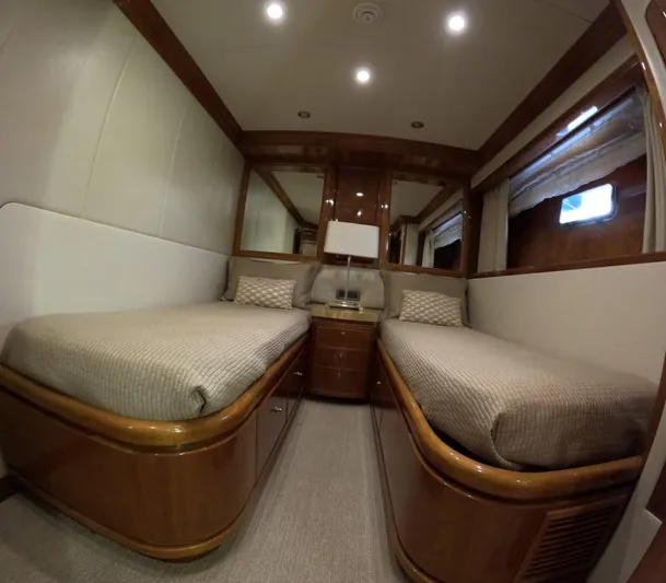 Sterling V Yacht Photos Pics Luxurious twin cabin interior on 2007 Hargrave 93' yacht, featuring elegant wood finishes.