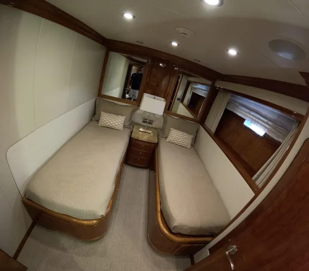 Sterling V Yacht Photos Pics Luxurious twin cabin interior of 2007 Hargrave 93' yacht with elegant wood finishes.