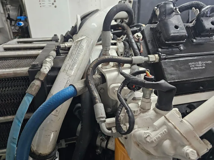 Sterling V Yacht Photos Pics Engine components of a 2007 Hargrave 93' yacht, featuring hoses and mechanical parts.