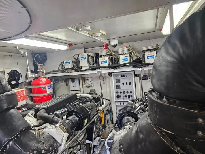 Sterling V Yacht Photos Pics Engine room of 2007 Hargrave 93' yacht, featuring machinery and control panels.