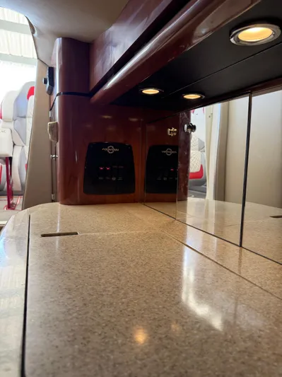  Yacht Photos Pics Interior of a 2008 Fountain 38 Lightning boat with sleek countertops and ambient lighting.