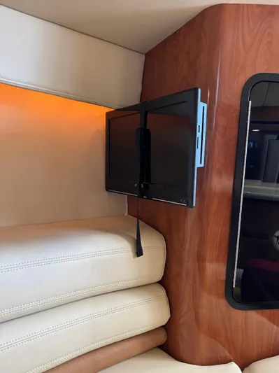  Yacht Photos Pics 2008 Fountain 38 Lightning interior with mounted TV and leather seating.