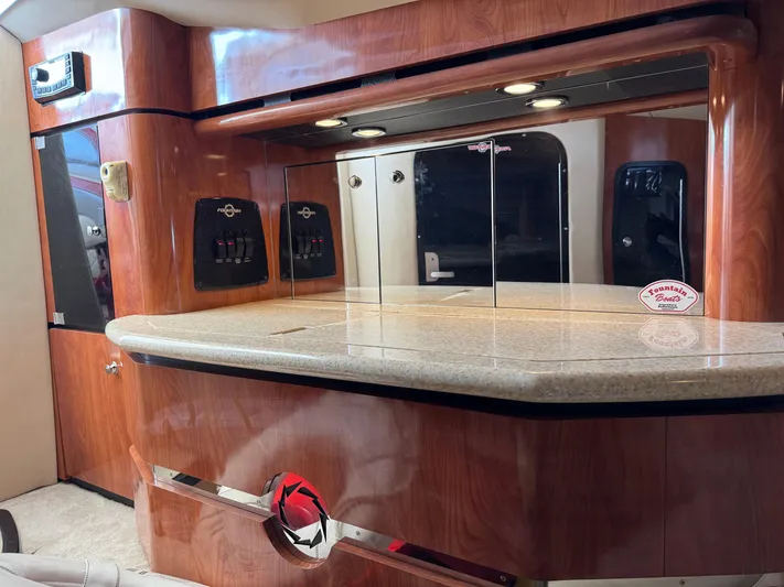  Yacht Photos Pics Luxurious interior of a 2008 Fountain 38 Lightning boat with polished wood and granite finishes.