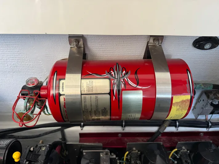  Yacht Photos Pics Red fire extinguisher mounted in a 2008 Fountain 38 Lightning boat engine compartment.
