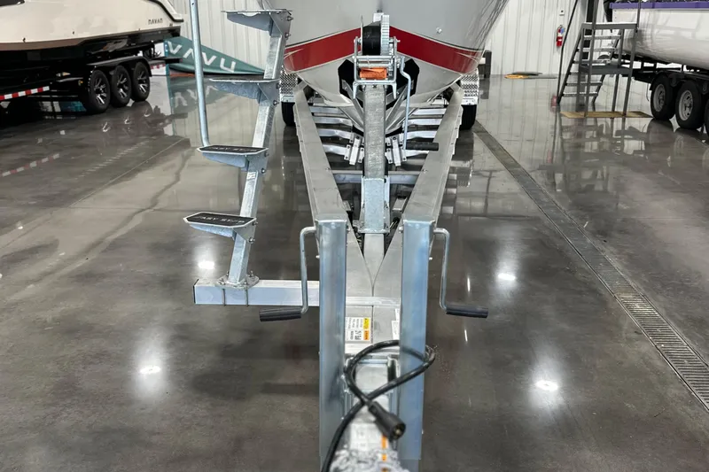  Yacht Photos Pics 2008 Fountain 38 Lightning boat on trailer in a polished indoor showroom.