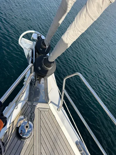  Yacht Photos Pics Bow of 2022 Hanse 510 yacht with sails, on calm water.