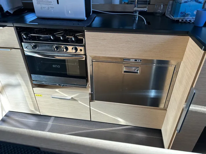  Yacht Photos Pics Modern kitchen in 2022 Hanse 510 yacht with stove and dishwasher.