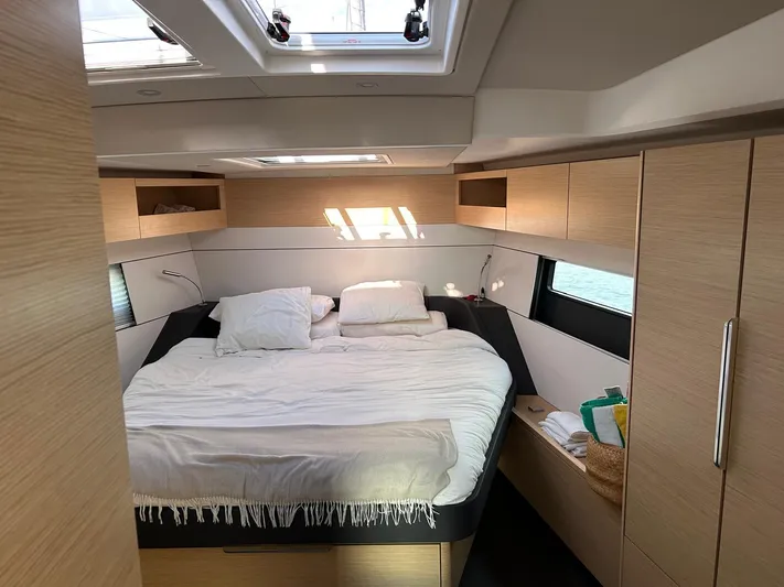  Yacht Photos Pics Luxurious cabin interior of 2022 Hanse 510 yacht with cozy bed and modern design.
