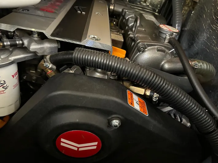  Yacht Photos Pics Engine compartment of a 2022 Hanse 510 yacht, showcasing mechanical components and wiring.