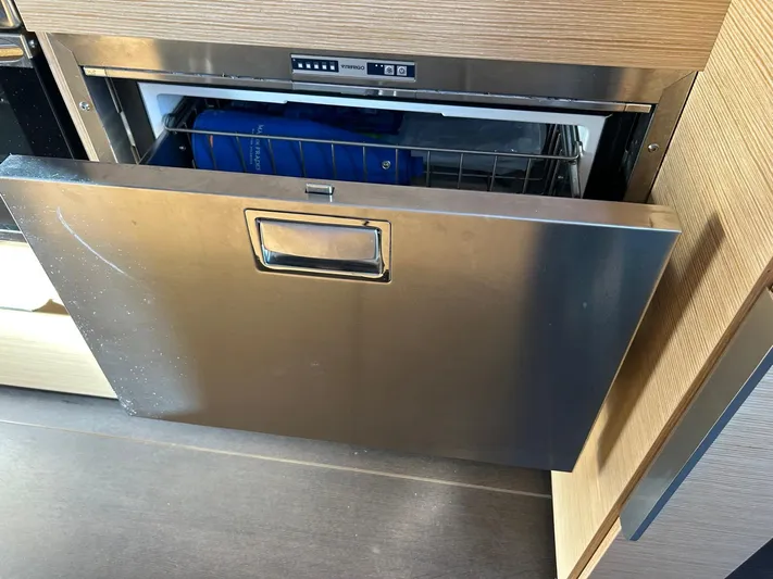  Yacht Photos Pics Stainless steel dishwasher drawer in a 2022 Hanse 510 yacht kitchen.