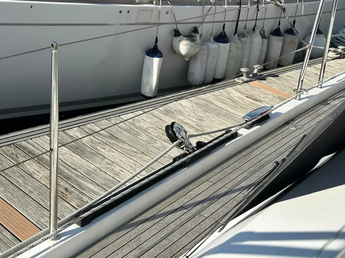  Yacht Photos Pics Deck of 2022 Hanse 510 yacht with fenders and wooden flooring.