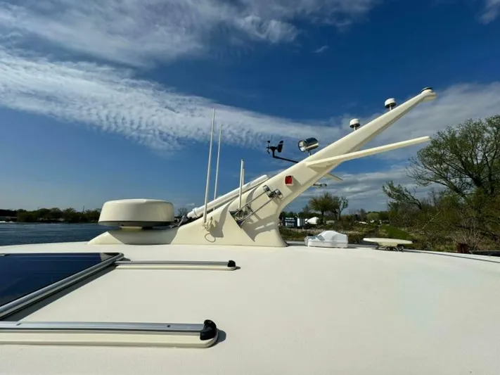 Castlefinn Yacht Photos Pics 2018 Palm Beach Motor Yachts PB55 deck with radar and antennas under blue sky.