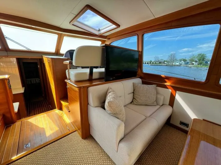 Castlefinn Yacht Photos Pics Luxurious 2018 Palm Beach Motor Yachts PB55 interior with plush seating and scenic water views.