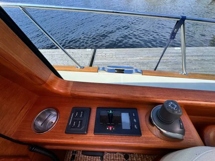Castlefinn Yacht Photos Pics Control panel of 2018 Palm Beach Motor Yachts PB55, featuring joystick and switches, dockside view.