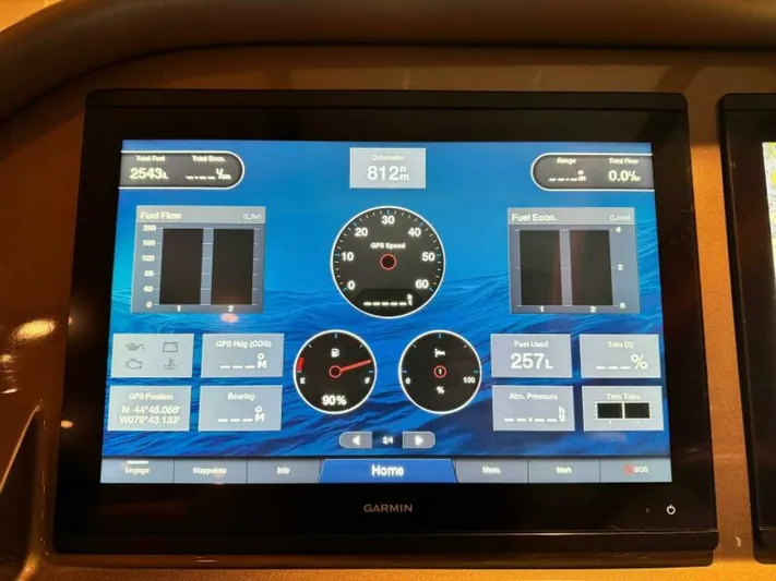 Castlefinn Yacht Photos Pics Dashboard display of a 2018 Palm Beach Motor Yachts PB55, showing navigation and fuel data.