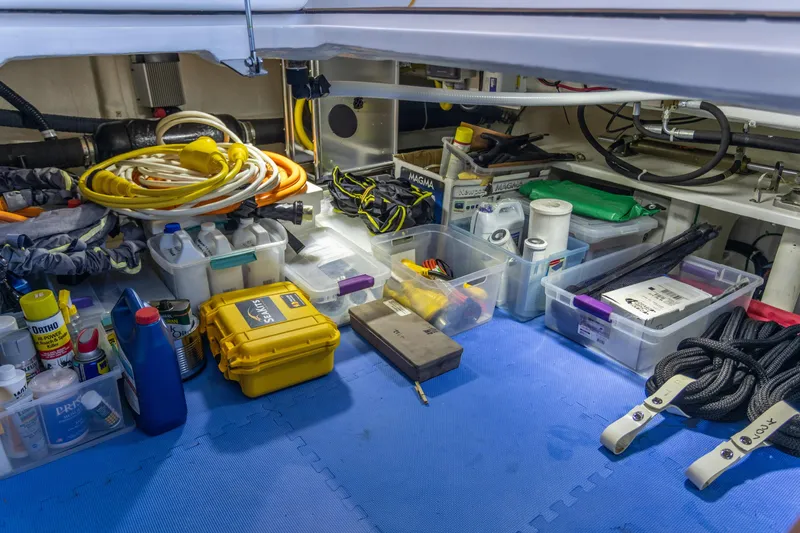 Boondoggle Yacht Photos Pics Organized storage area in 2021 North Pacific 49 Pilothouse with tools and supplies.