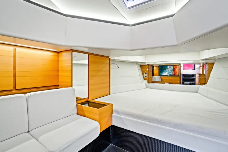 Corso Red Yacht Photos Pics Luxurious interior of 2021 Wally 48 yacht with modern wood and white furnishings.