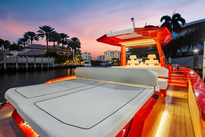 Corso Red Yacht Photos Pics Luxurious 2021 Wally 48 yacht at sunset, featuring sleek design and elegant lighting.