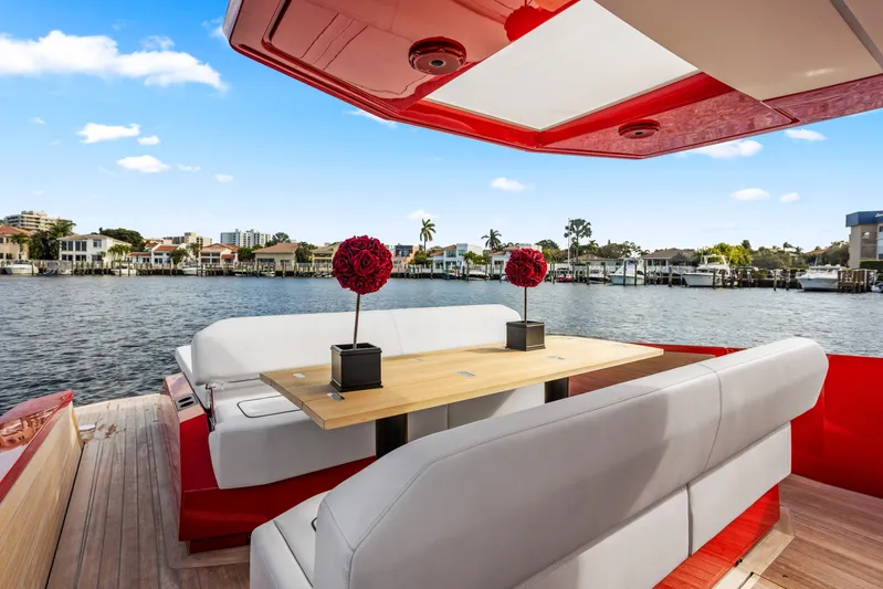 Corso Red Yacht Photos Pics Luxurious 2021 Wally 48 yacht with elegant seating and waterfront view.