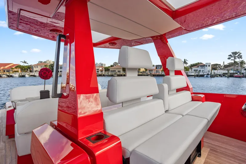 Corso Red Yacht Photos Pics Luxurious 2021 Wally 48 yacht interior with sleek red and white seating, dockside view.